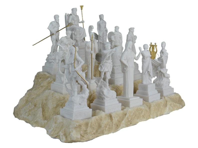 May include: A white marble sculpture set of the twelve Greek gods and goddesses. The figures are arranged on a white marble base with a textured surface. The sculptures are detailed and realistic, with each god and goddess depicted in their traditional pose.