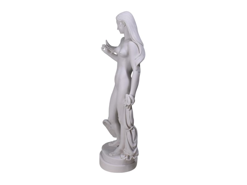 May include: White marble statue of a woman standing with her arms raised, holding a piece of fabric in her left hand. The statue is on a white marble base.