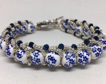 Ceramic White with Blue Flowers Beaded Bracelet wrapped in Silver Seed Beads with Blue Crystals, Handmade and Beautiful!