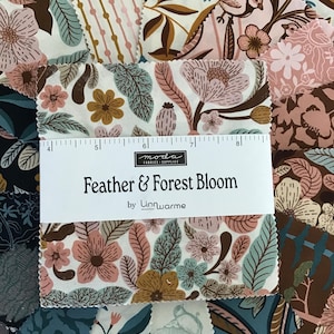 May include: A stack of square fabric swatches featuring floral and bird patterns in shades of cream, pink, brown, and teal. A white paper band across the center displays the text "Feather & Forest Bloom by Linnwarme" and a ruler measuring 4 to 8 inches.
