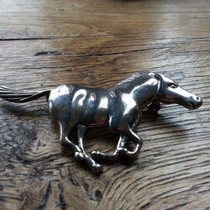 Large sterling silver galloping horse brooch