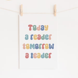 May include: A printable wall art design with the text "Today a reader tomorrow a leader" in colorful, rounded letters.