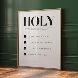 May include: A white poster with black text that reads "HOLY" and lists four guiding principles to help recognize the promptings of the Holy Spirit. The principles are: 1. Stand in Holy Spaces, 2. Stand with Holy People, 3. Testify of Holy Truths, and 4. Listen to the Spirit. The poster is signed "Gary E. Stevenson".