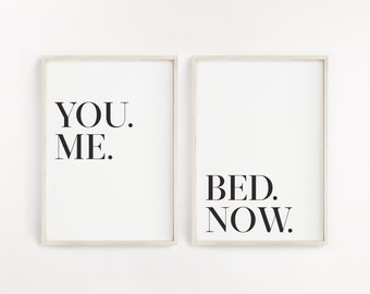 May include: Two framed prints with black text on a white background. The first print says "YOU. ME." and the second print says "BED. NOW."