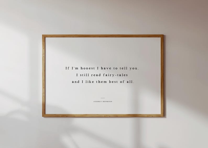 May include: A framed print with a light wood frame. The print features the quote, "If I'm honest I have to tell you. I still read fairy-tales and I like them best of all." The quote is in a simple, elegant font.
