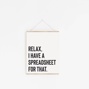 May include: A white framed print with black text that reads "Relax, I have a spreadsheet for that."