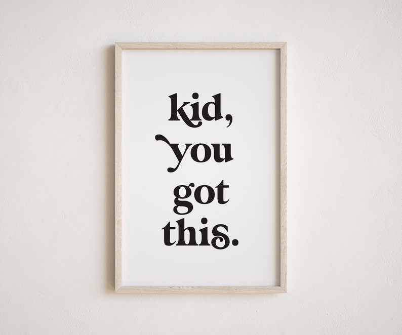 May include: A framed print with the text "kid, you got this." in black bold font on a white background.