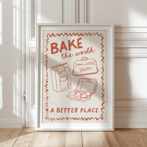 May include: A red and white poster with the text "BAKE the world a BETTER PLACE" and illustrations of baking ingredients, including a bag of flour, a container of butter, and a carton of eggs.