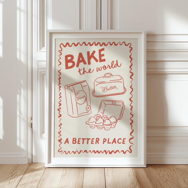 May include: A red and white poster with the text "BAKE the world a BETTER PLACE" and illustrations of baking ingredients, including a bag of flour, a container of butter, and a carton of eggs.