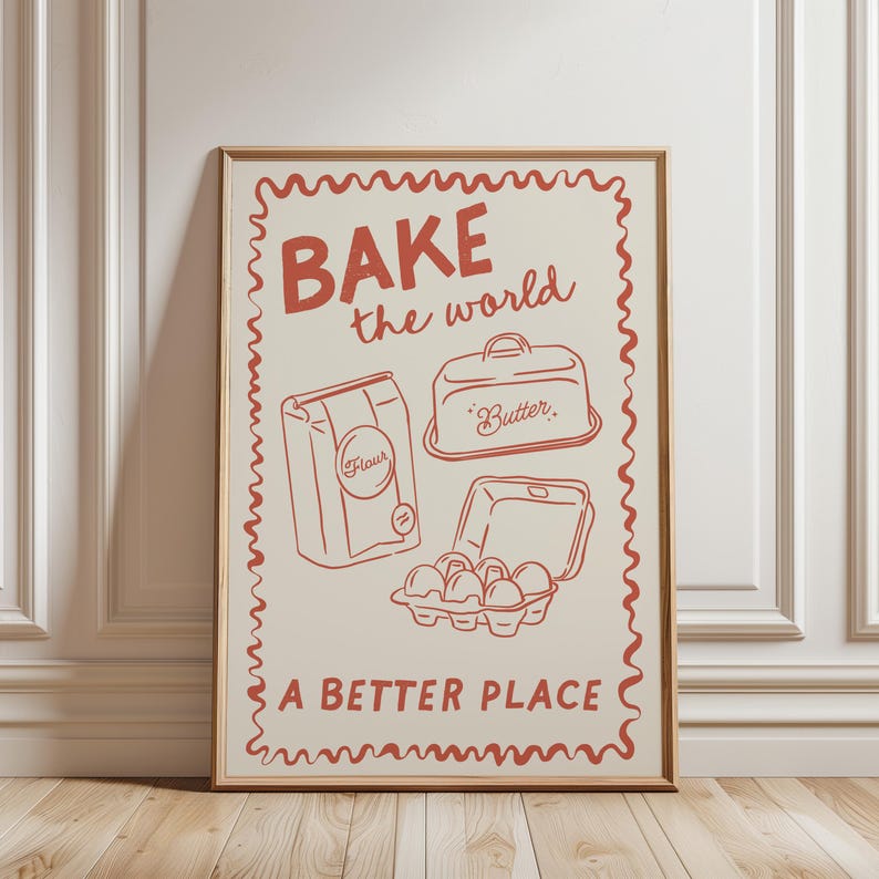 May include: A vintage-style poster with a red and white design. It says "BAKE the world a better place" and features illustrations of a bag of flour, a butter dish, and a carton of eggs.