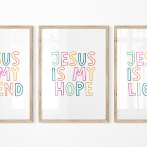 May include: Three framed prints with the text "Jesus is my" followed by "friend", "hope", and "light". The text is in a colorful, outlined font.