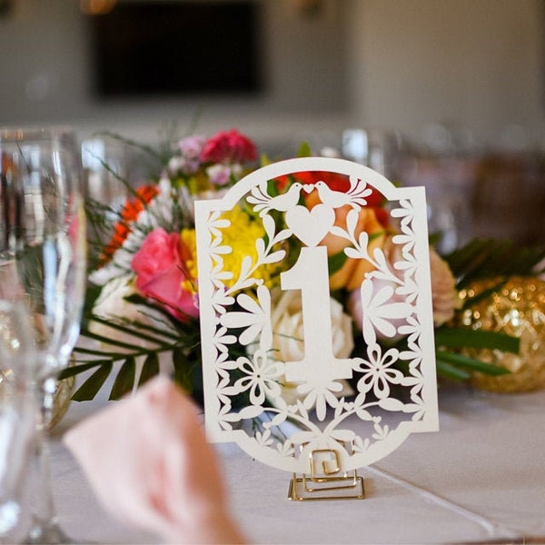 White Table Numbers in Papel Picado style with metallic look and Love birds .