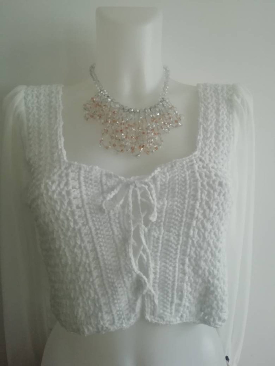 Women's Crochet White Sleeveless Fitted Crop Top with Ruffled Hem Detail