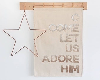 O Come let us adore Him Christmas wall hanging in silver or gold glitter