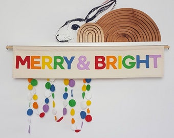 Merry & Bright Christmas wall hanging in rainbow bright colours.