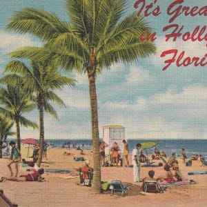 May include: A vintage postcard featuring a sunny beach scene in Hollywood, Florida, with tall palm trees lining the sand. People are relaxing on the beach under umbrellas and near a white lifeguard stand. The text reads, It's Great to be in Hollywood Florida!