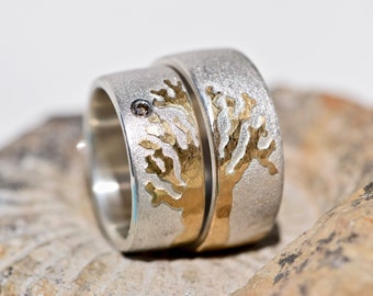 Handmade silver wedding rings with rose gold and diamond
