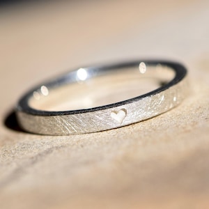 Silver engagement ring for the marriage proposal with heart