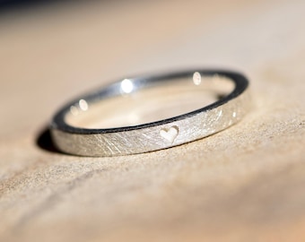 Silver engagement ring with heart