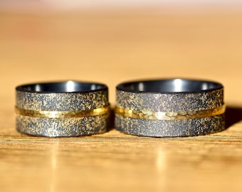 Handmade wedding rings blackened with gold