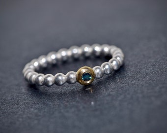 Silver ball ring with blue diamonds