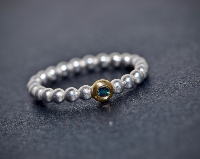 Silver ball ring with blue diamond