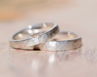 Wedding rings hammered silver with heart