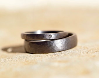 Tantalum wedding rings with hammered surface and heart