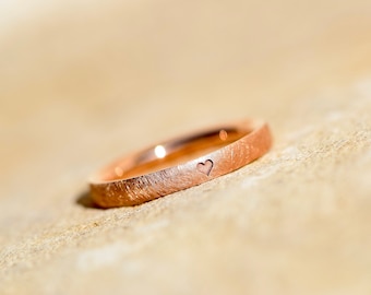 red gold engagement ring with heart