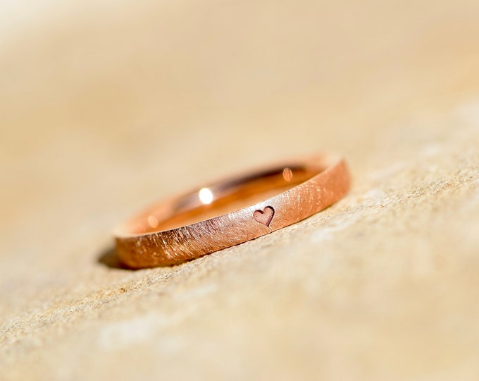 red gold engagement ring with heart
