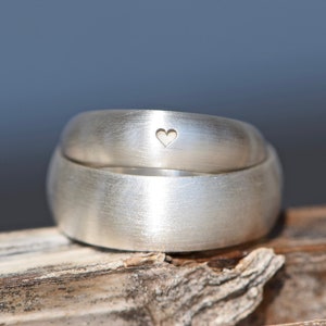Half-round wedding rings with heart