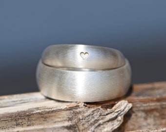 Half round wedding rings with heart