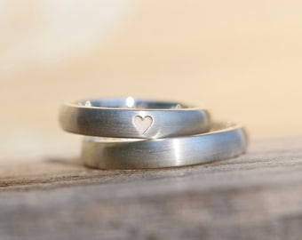 Classic silver wedding rings with heart