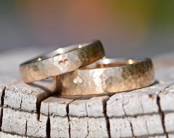 Rose gold wedding rings with hammered finish and heart
