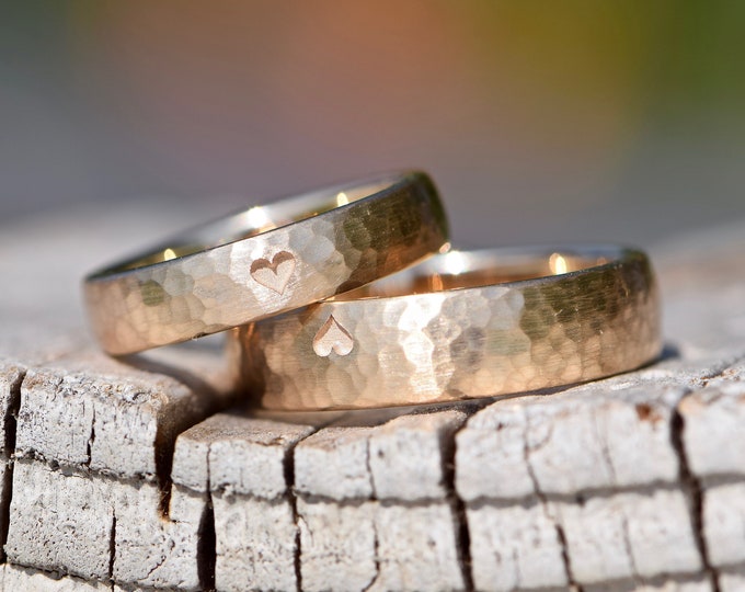 Rose gold wedding rings with hammered finish and heart