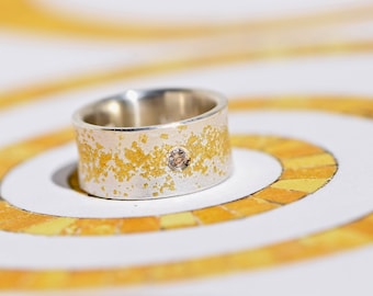 Wide silver ring with fine gold and diamond