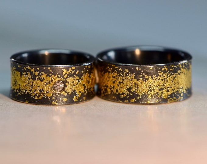 Black wedding rings with diamond and gold from the *Stardust* series