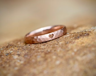 Engagement ring made of red gold hammered with heart