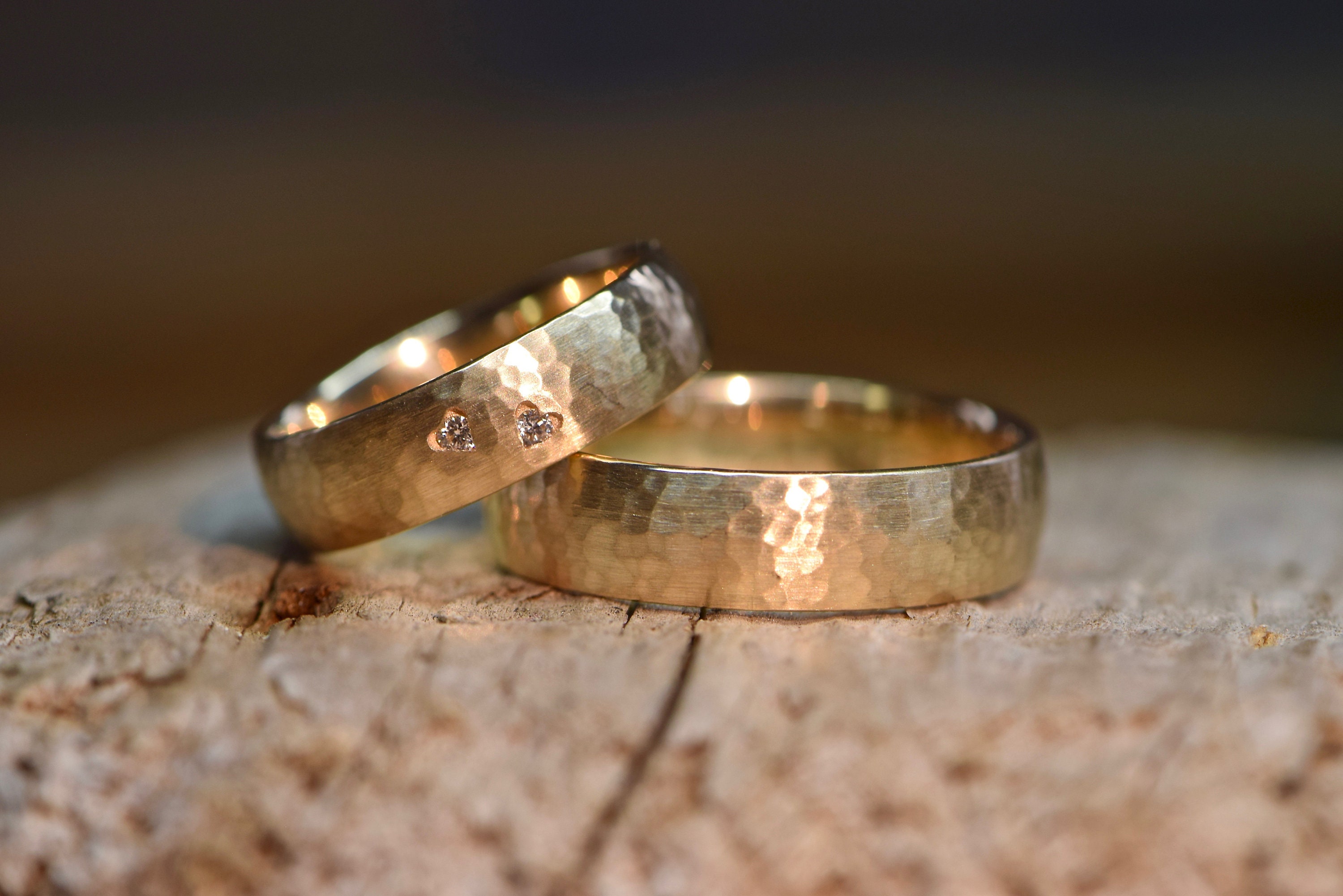Wedding rings rose gold hammered with hearts and diamonds