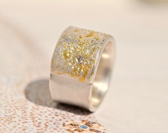 Wide silver ring with fine gold and diamonds