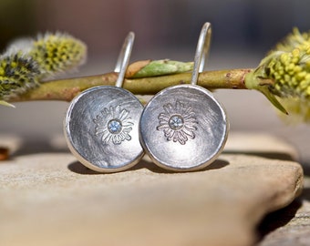 Silver earrings with platinum and diamonds