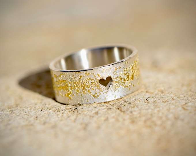 Silver engagement ring with gold dust and heart