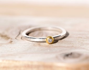 Diamond ring made of silver with gold as an engagement ring or birthday gift