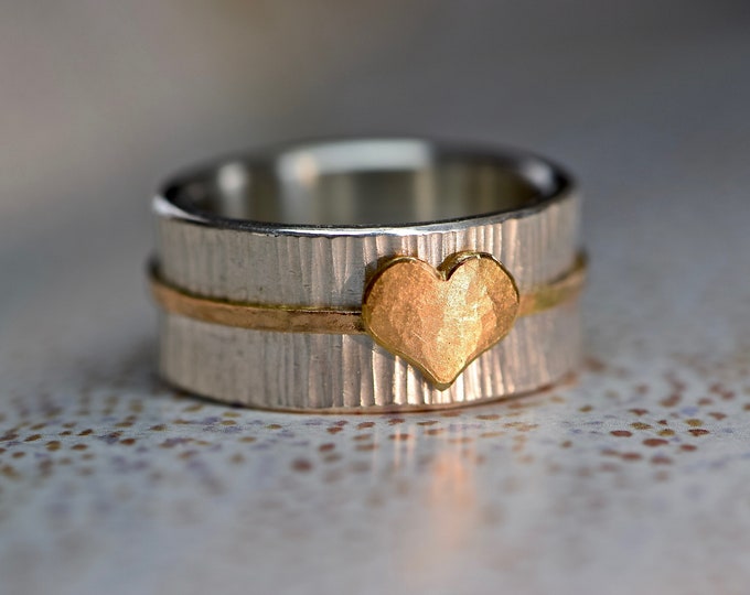 Wide silver ring with red gold heart