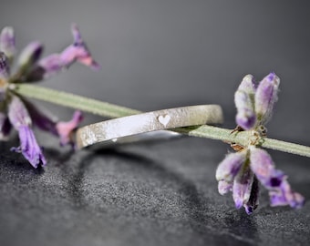 Silver engagement ring with a heart