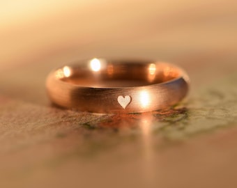 Red gold engagement ring with heart