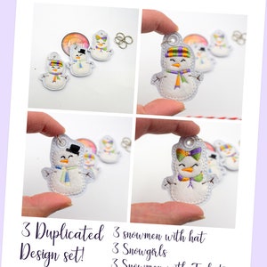 May include: Set of nine embroidered felt snowman ornaments. Three snowmen wear hats, three snowgirls wear bows, and three snowmen wear top hats. The ornaments are white with colorful accents.