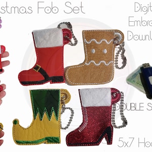 May include: A collection of Christmas-themed fob sets, including Santa boots, gingerbread boots, and elf boots. The designs are double-sided and come with keychains. The text "Christmas Fob Set" and "Digital Embroider Download" are visible.