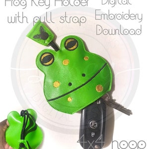 May include: Green frog-shaped key holder with a pull strap. The frog has gold accents and a fly on its back. The key holder is designed for a 4x4 hoop embroidery machine. Digital embroidery download.