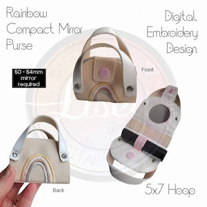 May include: Digital embroidery design for a rainbow compact mirror purse. The design includes a rainbow, a mirror, and a lipstick holder. The design is for a 5x7 hoop.